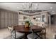 Open dining area adjacent to kitchen featuring a large round table and stylish decor at 17673 E Bronco Dr, Queen Creek, AZ 85142