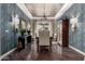 Formal dining room featuring decorative ceiling, elegant lighting, and stylish furniture at 17673 E Bronco Dr, Queen Creek, AZ 85142