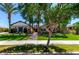 Beautiful home with lush front lawn, desert landscaping, and brick pathway at 17673 E Bronco Dr, Queen Creek, AZ 85142