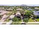 Aerial view of a charming home boasting a well-manicured lawn and mature landscaping at 17673 E Bronco Dr, Queen Creek, AZ 85142