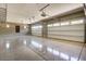 Spacious three-car garage with ample space for vehicles and storage; note the clean floors and bright lighting at 17673 E Bronco Dr, Queen Creek, AZ 85142