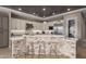 Modern kitchen bar with stone accents, stainless steel appliances, and ample counter space at 17673 E Bronco Dr, Queen Creek, AZ 85142