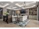 Bright living room with a fireplace, travertine floors, and sophisticated decor at 17673 E Bronco Dr, Queen Creek, AZ 85142