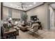 Comfortable living room featuring neutral tones, stylish furnishings, and ample natural light at 17673 E Bronco Dr, Queen Creek, AZ 85142