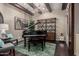 Cozy living space with grand piano, beamed ceiling, and stylish decor at 17673 E Bronco Dr, Queen Creek, AZ 85142