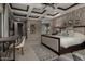 The spacious main bedroom offers a luxurious king size bed and tray ceiling, creating a peaceful retreat at 17673 E Bronco Dr, Queen Creek, AZ 85142