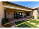 Back patio featuring a dining area, lush landscaping, a ceiling fan and access to outdoor living at 17673 E Bronco Dr, Queen Creek, AZ 85142