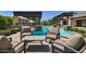 Outdoor seating area near a private pool and entertainment area at 17673 E Bronco Dr, Queen Creek, AZ 85142