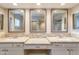 This primary bathroom has granite counters, tile backsplash, and three large vanity stations at 1871 Leisure World --, Mesa, AZ 85206