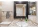 Bathroom featuring granite counters, backsplash, decorative mirror and modern fixtures at 1871 Leisure World --, Mesa, AZ 85206