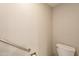 Neutral tones create a serene feel in this bathroom with toilet and safety rail at 1871 Leisure World --, Mesa, AZ 85206