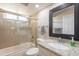 Stylish bathroom features granite counters, a tub-shower combo, and tile accents at 1871 Leisure World --, Mesa, AZ 85206