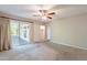 Bedroom with sliding glass door to patio, ceiling fan, closet and neutral colored walls at 1871 Leisure World --, Mesa, AZ 85206