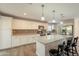 Modern kitchen with white cabinetry, stainless steel appliances, granite countertops, and a spacious island at 1871 Leisure World --, Mesa, AZ 85206