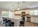 Modern kitchen featuring a granite island with bar seating and stainless steel appliances at 1871 Leisure World --, Mesa, AZ 85206