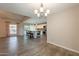 Open-concept living area with an island kitchen and natural light streaming through the windows at 1871 Leisure World --, Mesa, AZ 85206