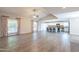 Bright open living area featuring tile flooring, large windows, and a glimpse into the modern kitchen at 1871 Leisure World --, Mesa, AZ 85206