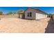 Spacious backyard with potential for landscaping and outdoor activities, surrounded by a block wall at 19038 N Arbor Dr, Maricopa, AZ 85138