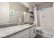 Modern bathroom featuring a granite countertop, white cabinets, and a shower-tub combination at 19038 N Arbor Dr, Maricopa, AZ 85138