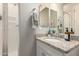 Bright bathroom featuring granite countertops, a mirror, and sleek finishes at 19038 N Arbor Dr, Maricopa, AZ 85138