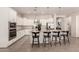 Beautiful kitchen featuring granite countertops, white cabinets, and a stainless steel oven at 19038 N Arbor Dr, Maricopa, AZ 85138