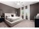 Serene main bedroom featuring a plush bed, soft carpet, and elegant curtains at 19038 N Arbor Dr, Maricopa, AZ 85138