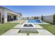 The backyard has artificial turf, square pavers, a pool with water feature, and an outdoor fire pit at 2153 E Cherrywood Pl, Chandler, AZ 85249
