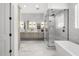 Bathroom boasts double sinks, soaking tub, and a glass-enclosed shower with modern fixtures at 2153 E Cherrywood Pl, Chandler, AZ 85249