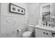 Updated bathroom features sleek modern fixtures, patterned tile walls, and decorative art at 2153 E Cherrywood Pl, Chandler, AZ 85249
