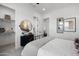 Cozy bedroom featuring modern decor, a walk-in closet, and a black accent table for a clean and relaxing space at 2153 E Cherrywood Pl, Chandler, AZ 85249