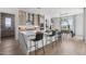Gourmet kitchen with a large marble island, modern appliances, and a seamless connection to the dining area at 2153 E Cherrywood Pl, Chandler, AZ 85249