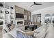 Bright living room featuring a cozy fireplace, stylish decor, and an open layout for entertaining at 2153 E Cherrywood Pl, Chandler, AZ 85249