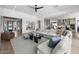Open-concept living area with a large sectional sofa, modern decor, and seamless flow to other spaces at 2153 E Cherrywood Pl, Chandler, AZ 85249