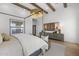 Main bedroom with hardwood floors, modern lighting, and neutral decor at 2153 E Cherrywood Pl, Chandler, AZ 85249