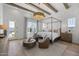 Spacious main bedroom with hardwood floors, decorative chandelier, and sitting area at 2153 E Cherrywood Pl, Chandler, AZ 85249