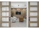 Cozy home office with wood-paneled walls, modern furniture, and elegant lighting at 2153 E Cherrywood Pl, Chandler, AZ 85249
