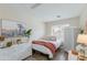 Charming bedroom with neutral tones, natural light, white wicker furniture and a cozy atmosphere at 21940 N 69Th Dr, Glendale, AZ 85310