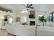 Spacious living room featuring vaulted ceilings, modern decor, fireplace, and stylish furnishings at 21940 N 69Th Dr, Glendale, AZ 85310