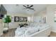 Cozy living room with modern decor, large sectional sofa, and a fireplace, creating a relaxing atmosphere at 21940 N 69Th Dr, Glendale, AZ 85310