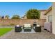Relaxing backyard patio area with outdoor seating and barbecue grill at 21940 N 69Th Dr, Glendale, AZ 85310
