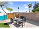 Outdoor seating area with a modern fire pit, perfect for relaxing and enjoying the backyard ambiance at 2232 E Karen Dr, Phoenix, AZ 85022
