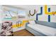Unique bedroom with creative wall art, a sleek daybed, and modern chair, offering a fun and stylish retreat at 2232 E Karen Dr, Phoenix, AZ 85022