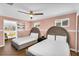 Spacious bedroom with two beds, closet, and ceiling fan at 2232 E Karen Dr, Phoenix, AZ 85022