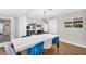Open dining room with bright windows and modern light fixture at 2232 E Karen Dr, Phoenix, AZ 85022
