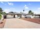 Inviting single-story house with a clean concrete driveway and desert-style landscaping at 2232 E Karen Dr, Phoenix, AZ 85022