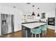 Modern kitchen featuring stainless steel appliances and a spacious island with seating at 2232 E Karen Dr, Phoenix, AZ 85022