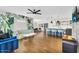 Open-concept living space with a breakfast bar, dining area, and hardwood floors at 2232 E Karen Dr, Phoenix, AZ 85022