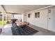 Outdoor patio featuring a dining set, grill, and tiled floor, perfect for entertaining at 2232 E Karen Dr, Phoenix, AZ 85022