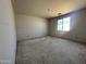 Bedroom featuring unfinished walls, a large window providing natural light, and spacious layout at 22812 E Lords Way, Queen Creek, AZ 85142