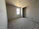 Bright bedroom featuring a single window, ready for personalization at 22812 E Lords Way, Queen Creek, AZ 85142